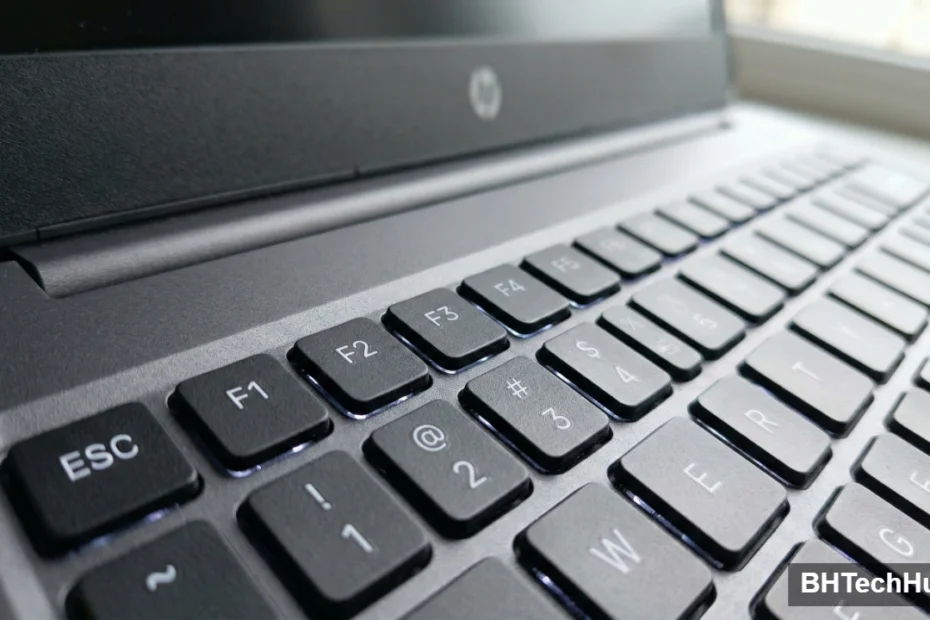 Close-up angled view of a modern laptop keyboard focusing on the top row function keys from F1 to F5.